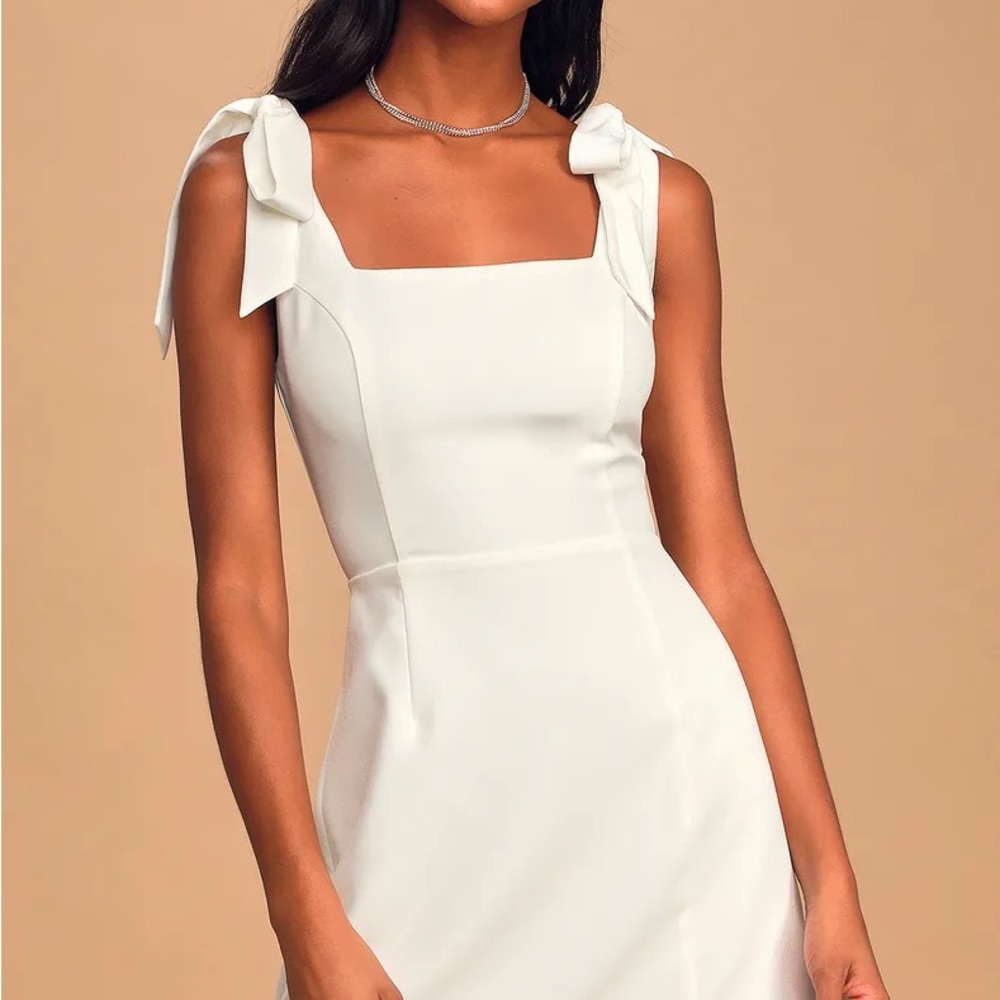 Brand new white mini dress with tie straps